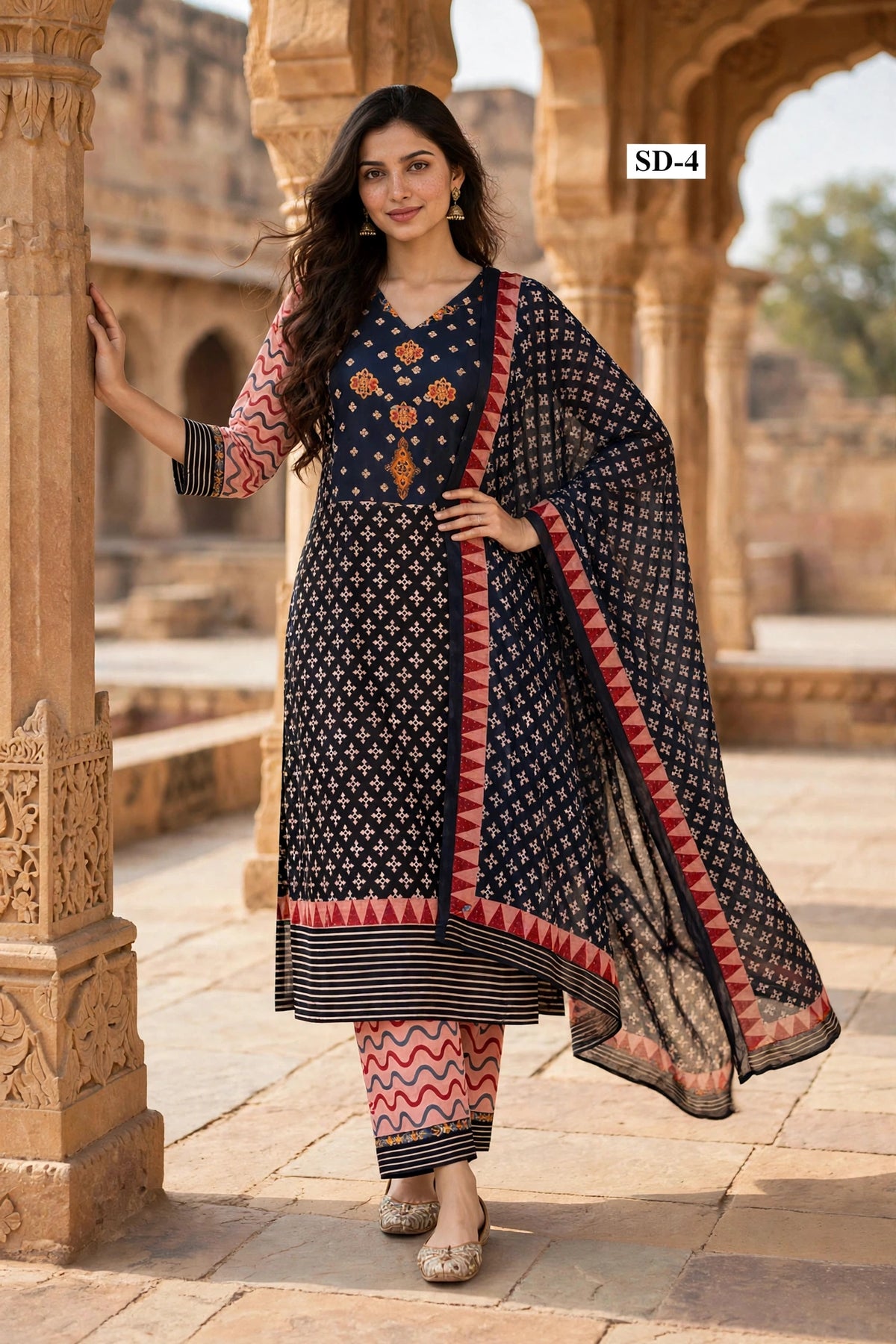 Wholesale SD-4 Black Orange Floral Butti 3 Pcs Suit - Semi Muslin | The Wardrobe Fabrics